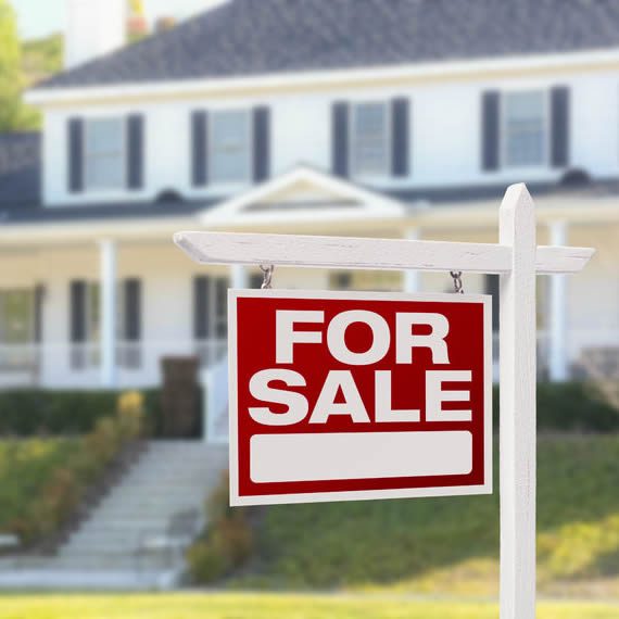 For sale sign in front of a successfully inspected two story home in Florida, USA