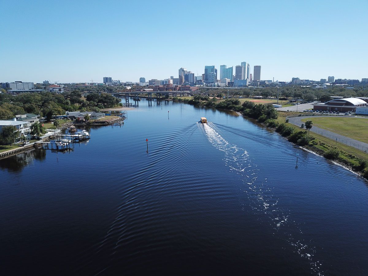 A boat driving through the river in Tampa Bay, Florida